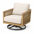 Sillón giratorio de ratán sintético con base metálica y cojines beige